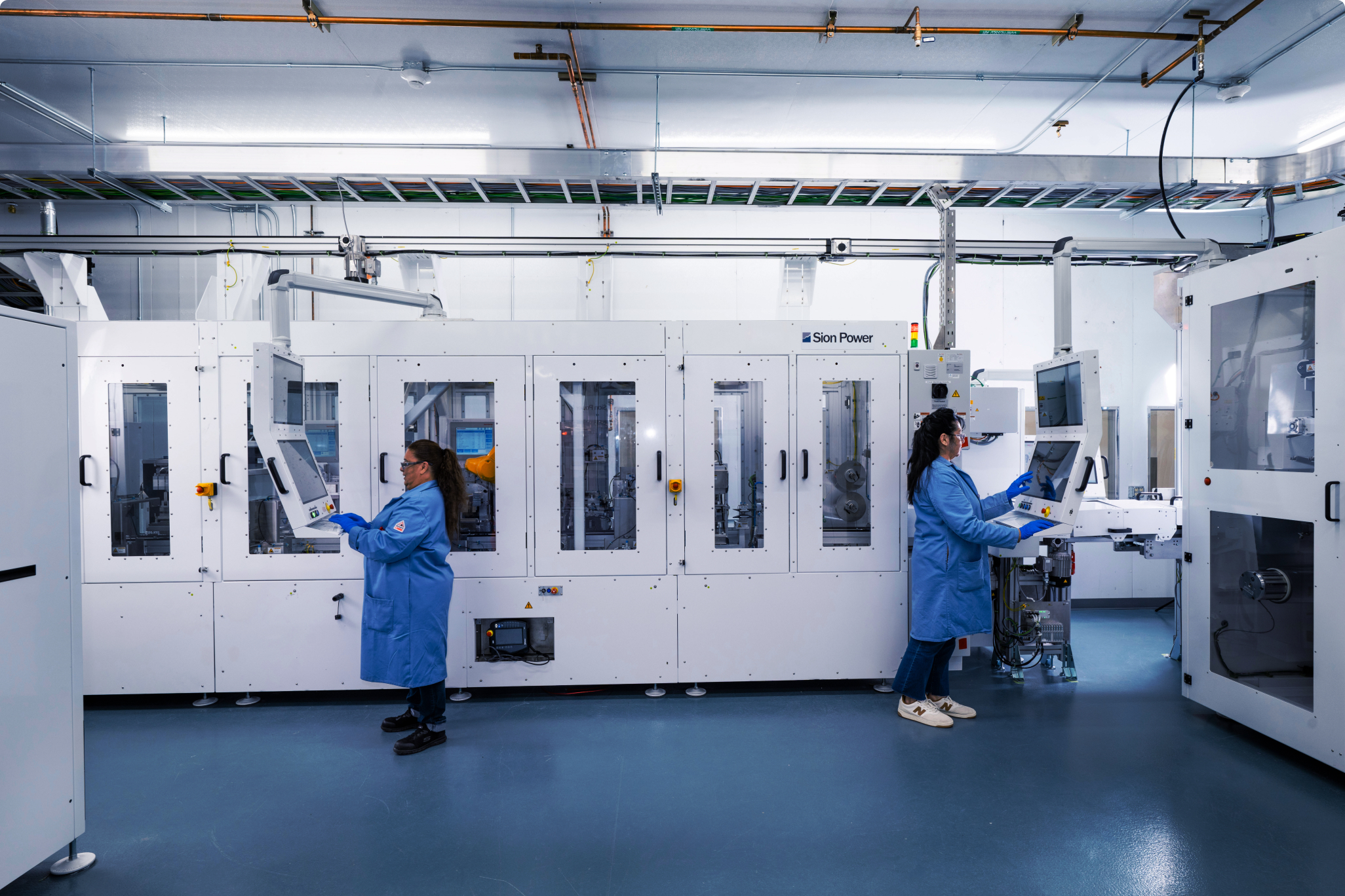 Women working on the Sion Power manufacturing line